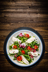 Greek salad on wooden background