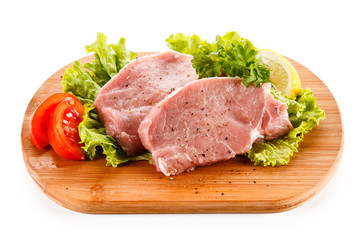 Fresh raw pork on cutting board on white background