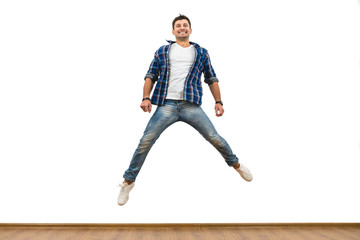 The man jumping on the white wall background