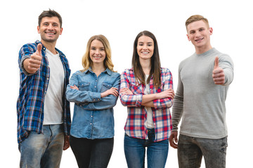 Obraz premium The happy four people thumb up on the white background