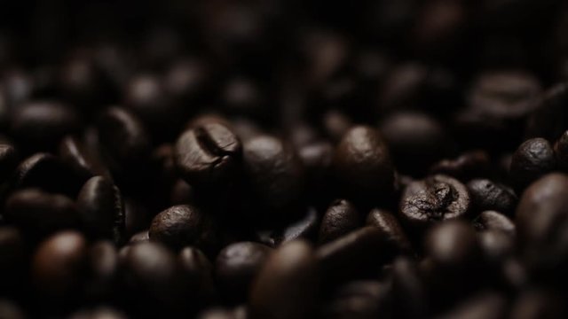 Closeup super slow motion shot of roasted coffee beans
