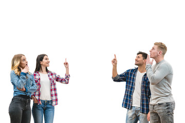 The four people stand and gesture on the white wall background