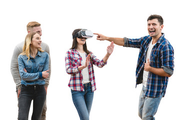 The four happy people play with virtual reality glasses on a white background