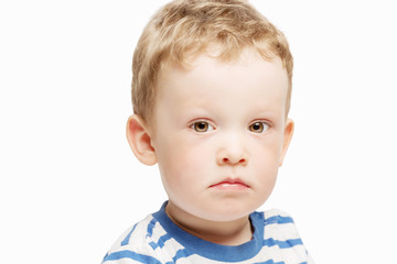 Serious little boy, close-up, isolated