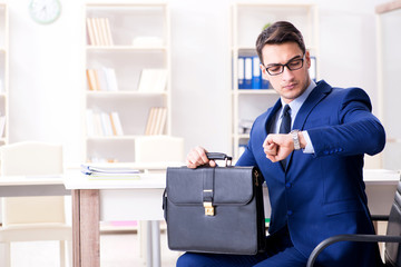 Fototapeta premium Young handsome businessman employee working in office at desk