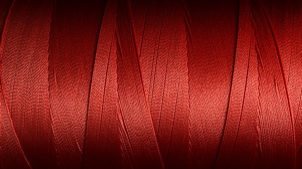 Macro picture of red color thread texture