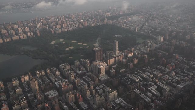 New York City aerial view of Central Park, the Upper West Side and Harlem, while flying over East Harlem at sunrise.