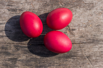 Painted Easter eggs on rustic wooden background