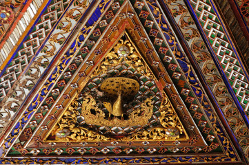 Fototapeta na wymiar Beautiful ceiling of Wat Phra Kaew Don Tao, Lampang, Thailand.