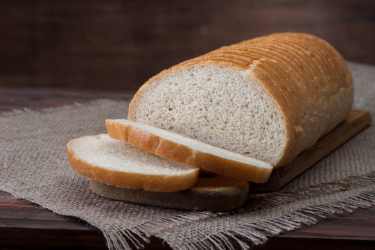 White Wheat Bread on wooden background