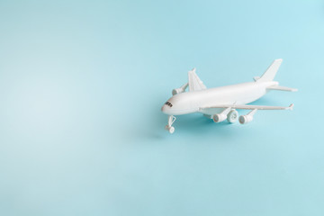 Plastic toy airplane on a Blue sky Background.