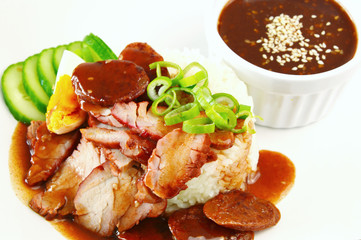 Barbecued red pork in sauce with rice