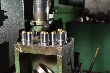 Pressing machine squeezes two parts together in the factory