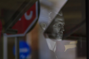 Mannequin in sunlight reflection