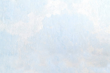 Abstract textured background on light blue putty