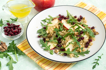 Vitamin vegetarian salad with quinoa, fruits and nuts
