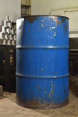 The barrel is blue, old and scratched in the plant room