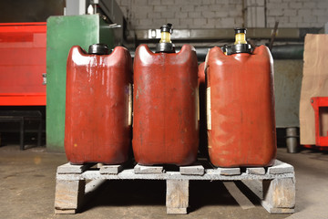 Oil cans, side view, at the factory for machine tools