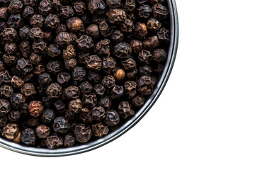 Black pepper seeds in pot isolated on white