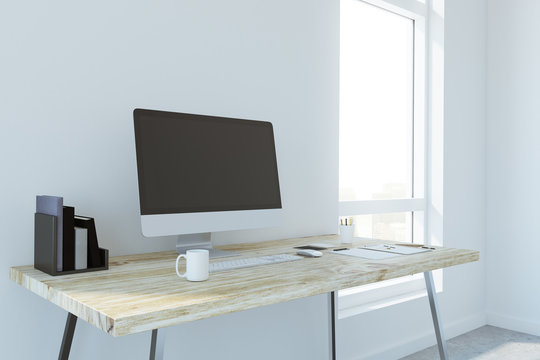 Creative designer desk with empty computer