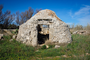 Abandoned trullo hut. Apulia countryside. Polignano, Italy