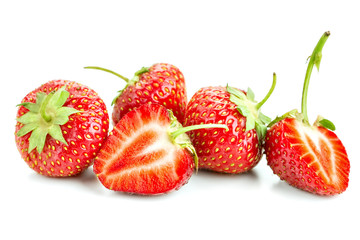 many berries ripe juicy strawberries on a white table