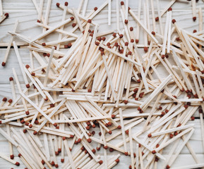 Matches. Background. Texture. Many matches lie on the table. Top view.