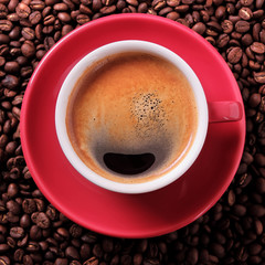 Red coffee cup filled full espresso americano black with background various dark roasted beans scattered flat lay square format photo