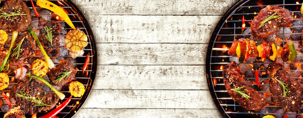 Top view of fresh meat and vegetable on grill placed on wood