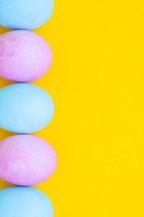 easter eggs on yellow background