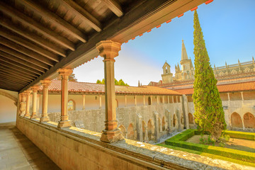 Obraz premium Portugal, Batalha. Aerial view of Batalha Monastery cloister and gothic bell tower on background of Batalha Monastery and Church. Aerial view from Monastery of Saint Mary of the Victory.