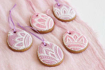 Homemade gingerbread Easter lilac and pink color in the form of egg with a floral pattern.