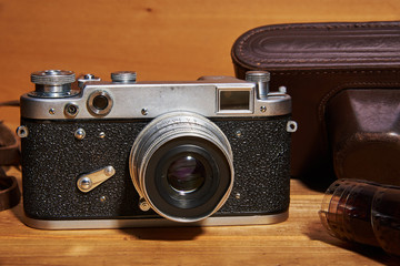 A film camera (analog camera) and a camera case made of leather that were made in the middle of the twentieth century