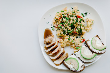 Plate with food on a white background