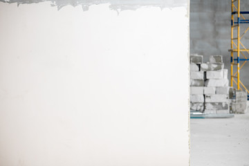 Empty wall for copy paste at the construction site indoors
