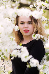 Young beautiful girl dressed in black jacket and black pants.