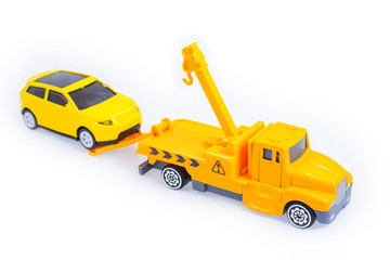Fototapeta premium Toy trucks for kids towing vehicle yellow isolate on white background 