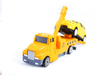 Fototapeta na wymiar Toy trucks for kids towing vehicle yellow isolate on white background 