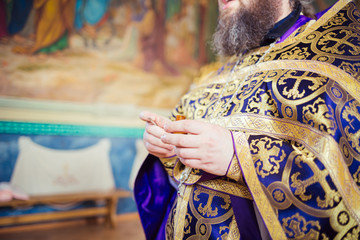 The priest holds a ceremony in the church