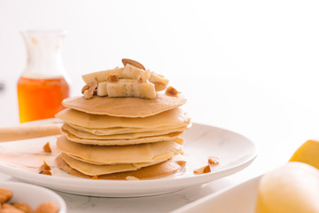 Breakfast. Banana pancakes with honey and nuts