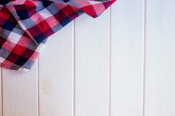 Wooden table in the kitchen with a tissue napkin