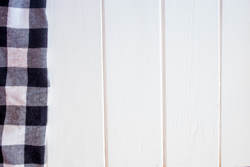 Wooden table in the kitchen with a tissue napkin