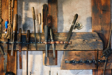 Old tools on the workbench in the workshop