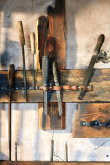 Old tools on the workbench in the workshop