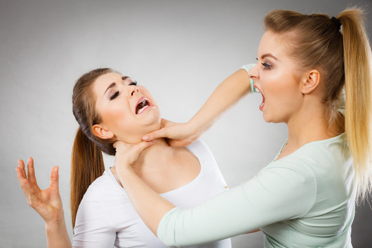 Two agressive women having argue fight