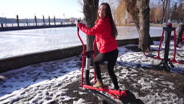 Girl exercising on street orbitrek