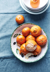 Fresh Mandarin Oranges in a Ceramic Bowl; flat lay