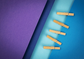 composition of colored papers and clothes pins
