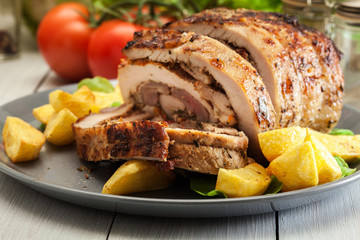 Roasted pork roll stuffed with other meat