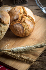 Roll breads on cutting board.